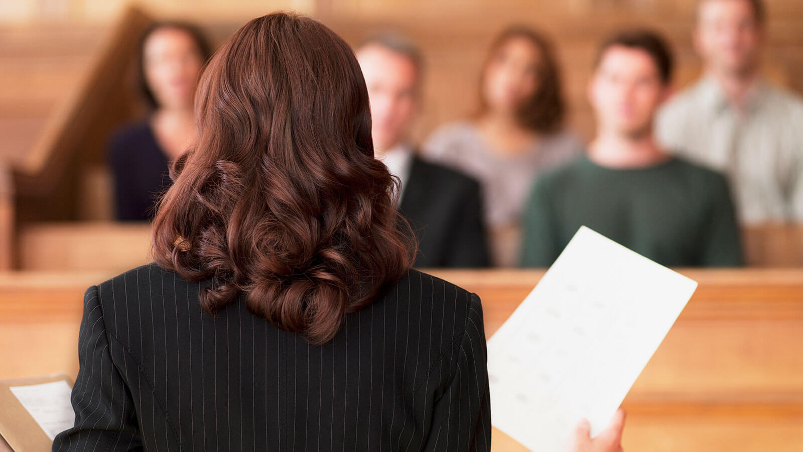 Back of woman talking to the court