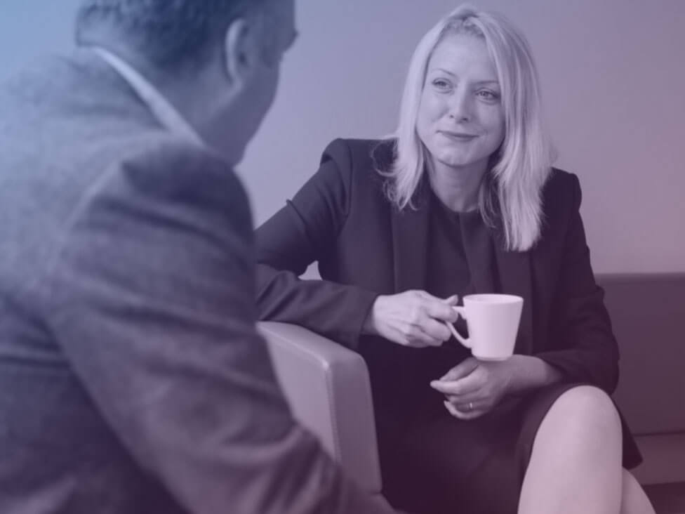 a man and a woman having a meeting