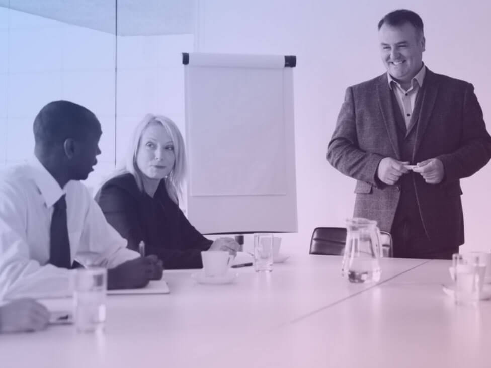 Two men and a woman having a meeting