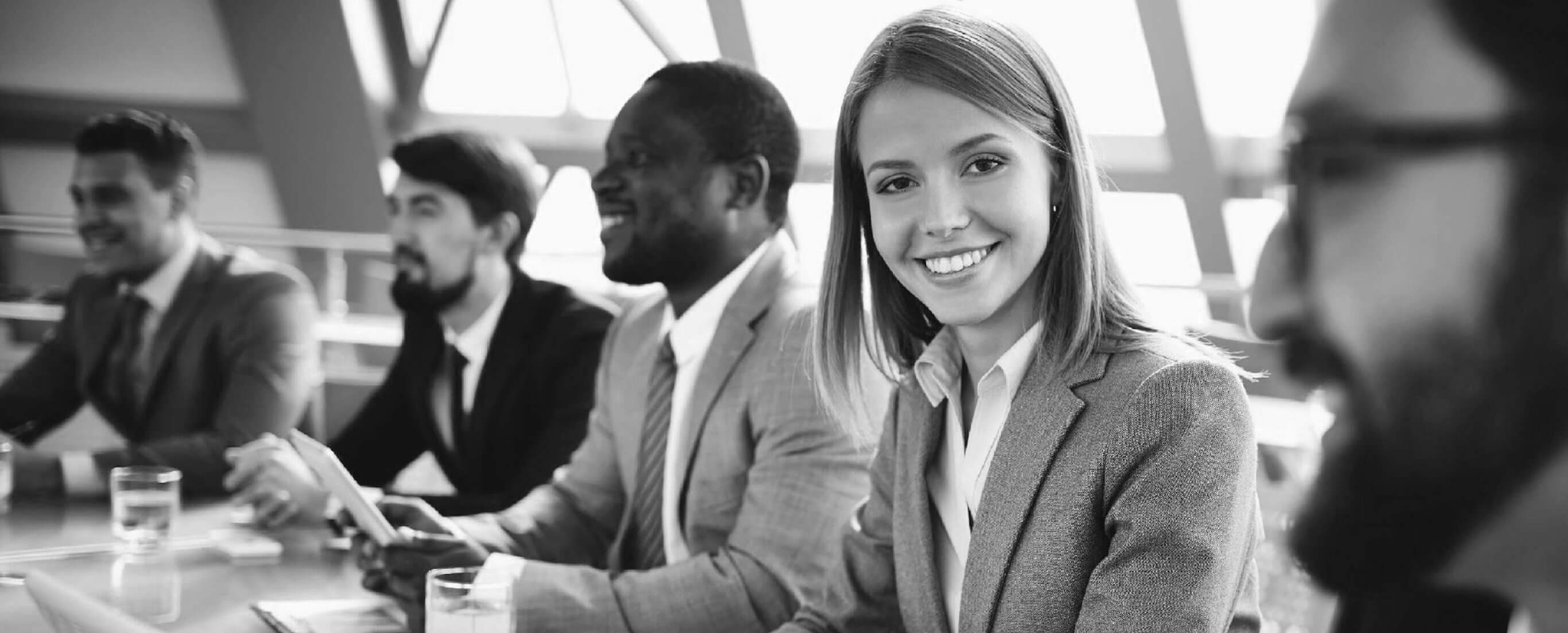 Woman smiling at the camera during a meeting